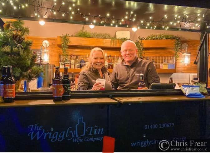Wriggly Tin bar staff smiling behind the bar
