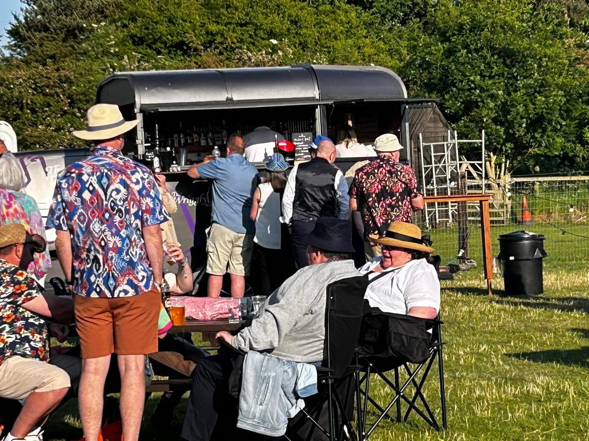 Guests gathered at the Wriggly Tin horsebox bar